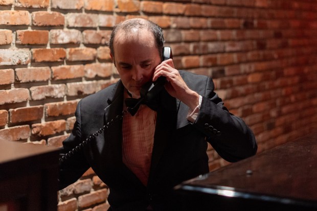 Pianist Kenny Haelsig takes a phone request while performing at the Harry Waugh Dessert Room inside of Bern's Steak House on Wednesday, Oct. 11, 2023 in Tampa.
