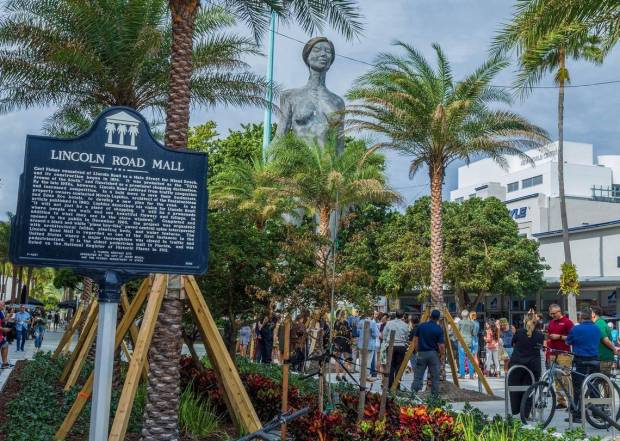 Miami Beach officials, residents and tourists attend the unveiling of the R-Evolution, a 45-foot-tall, 32,000-pound kinetic sculpture by artist Marco Cochrane on Tuesday, Nov. 14, 2023.