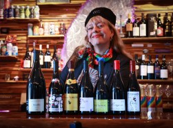Swirlery owner and advanced sommelier Melissa McAvoy with a selection of Beaujolais wines at her wine bar on East Michigan Street in Orlando, Wednesday, November 8, 2023. This year’s Beaujolais Nouveau release —the annual celebration for the youngest wine iteration of the gamay grape — will be marked on Beaujolais Nouveau Day, Nov. 16. (Joe Burbank/Orlando Sentinel)