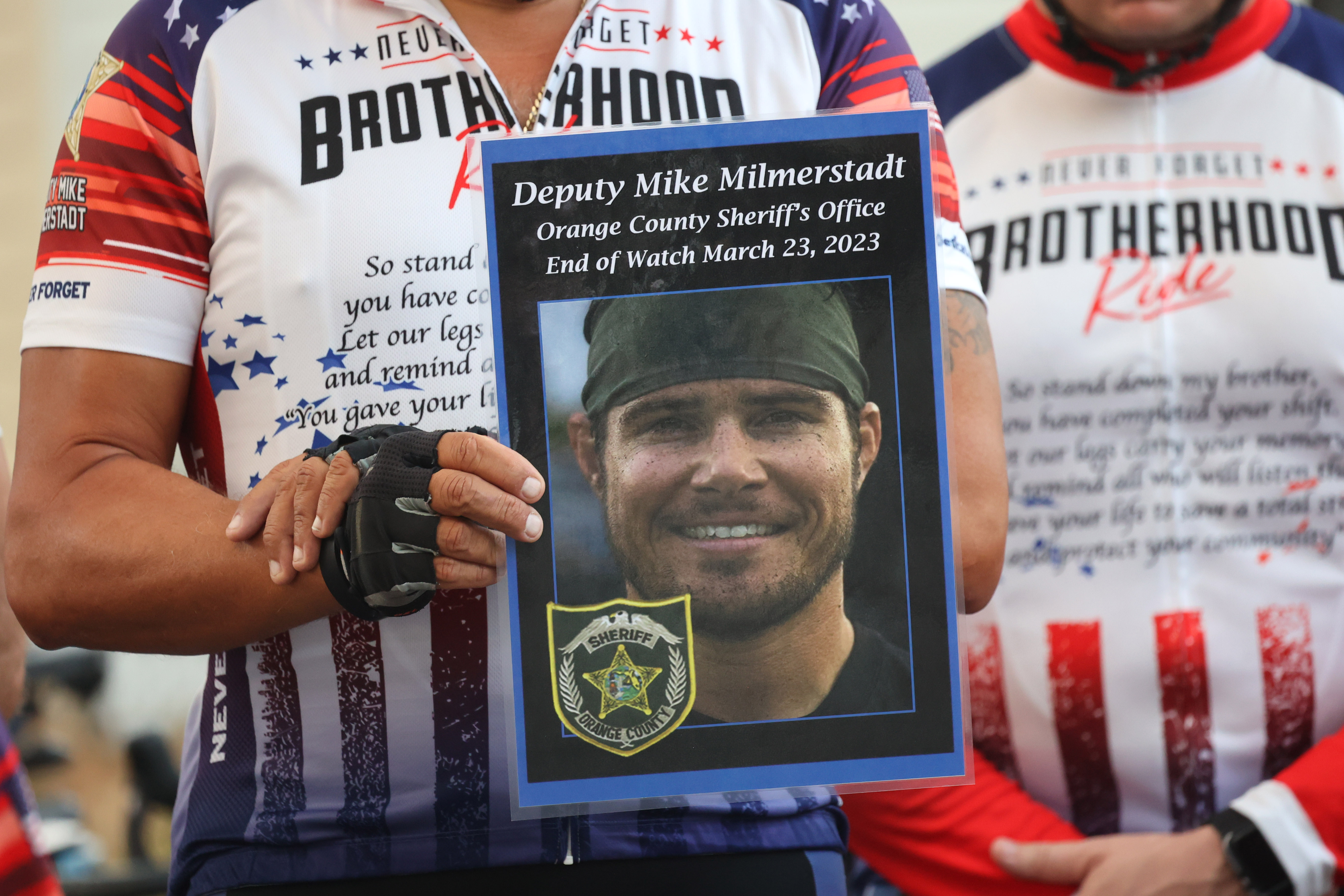 Remembrance poster for Orange county Deputy Mike Milmerstadt, before the Brotherhood Ride departs the Elks Lodge 1079, on their way to Cocoa Beach, on Tuesday, October 31, 2023. The ride is dedicated to the 28 Florida Fallen First Responders who died in the line of duty in 2022 while protecting their communities. They started in Naples and will end their 9-day ride through Florida in Miami.(Ricardo Ramirez Buxeda/ Orlando Sentinel)