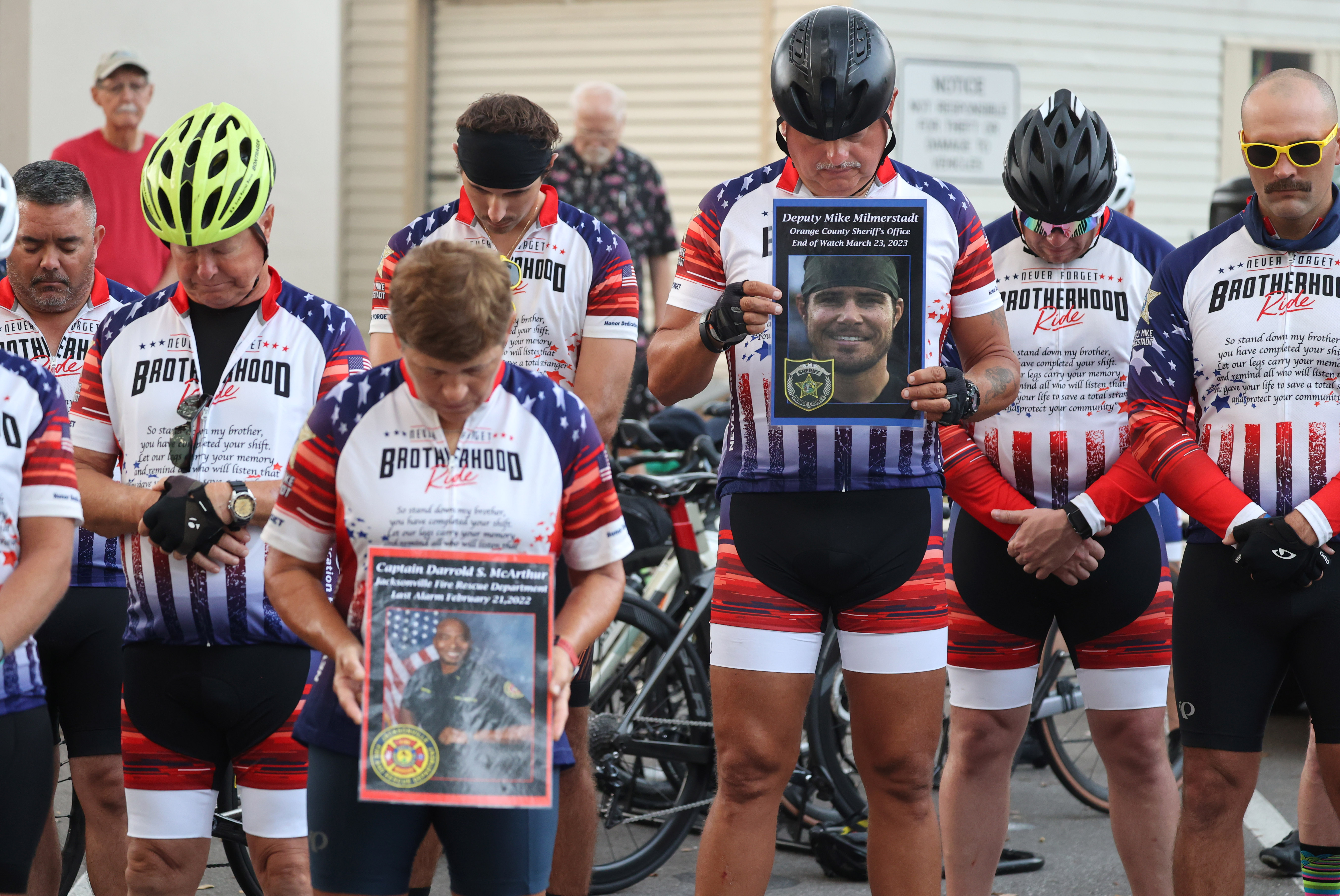 Cyclist participating in the Brotherhood Ride bow their heads during a prayer before departing the Elks Lodge 1079, on their way to Cocoa Beach, on Tuesday, October 31, 2023. The ride is dedicated to the 28 Florida Fallen First Responders who died in the line of duty in 2022 while protecting their communities. They started in Naples and will end their 9-day ride through Florida in Miami.(Ricardo Ramirez Buxeda/ Orlando Sentinel)