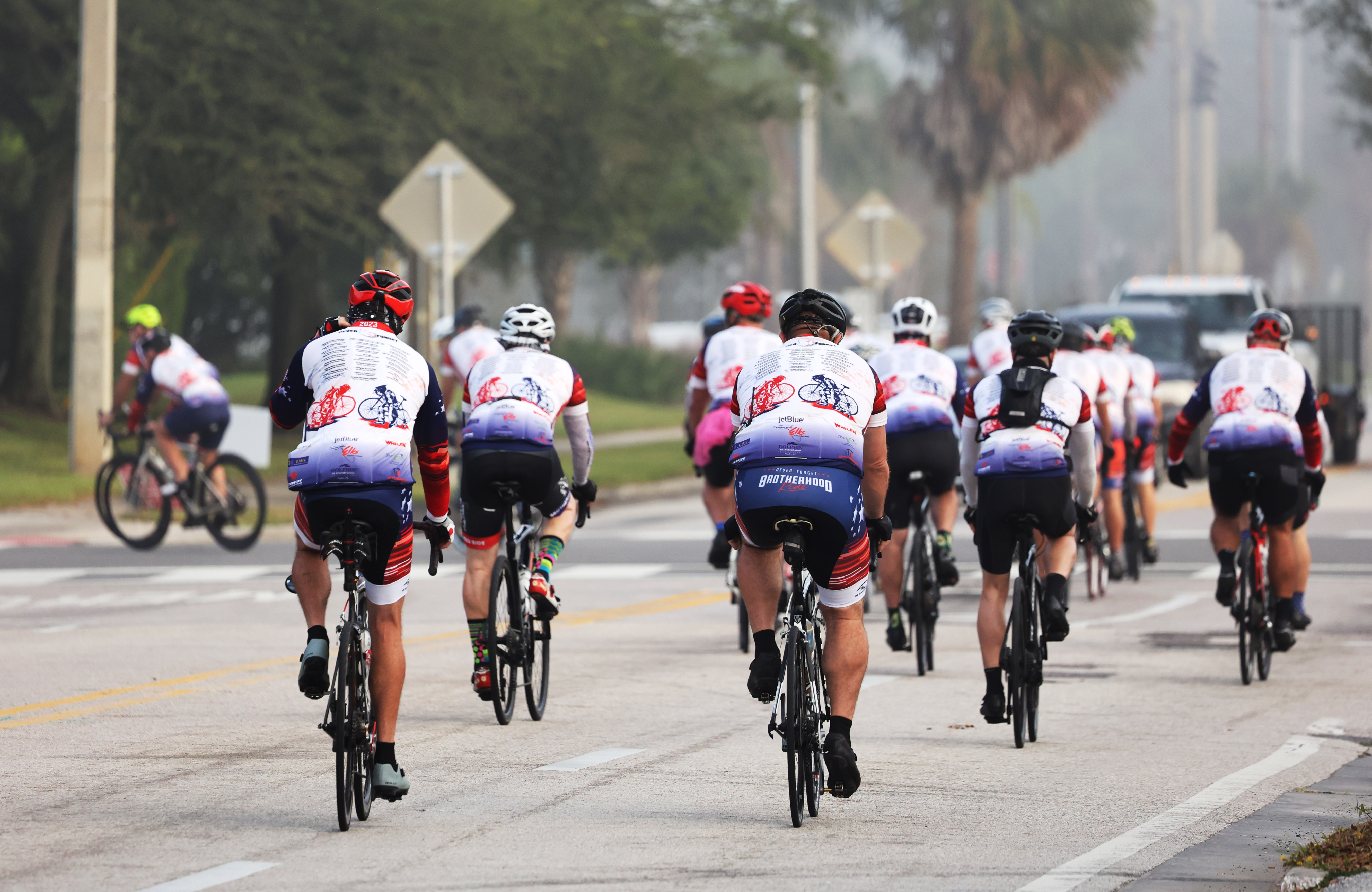 Cyclist participating in the Brotherhood Ride turn onto Robinson Street, on their way to Cocoa Beach, on Tuesday, October 31, 2023. The ride is dedicated to the 28 Florida Fallen First Responders who died in the line of duty in 2022 while protecting their communities. They started in Naples and will end their 9-day ride through Florida in Miami.(Ricardo Ramirez Buxeda/ Orlando Sentinel)