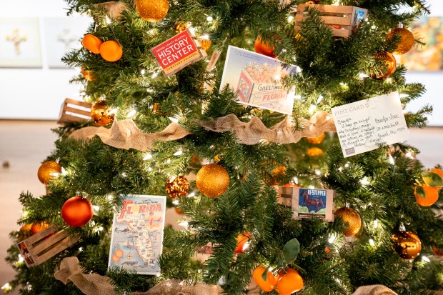 The Festival of Trees returns to Orlando Museum of Art for its 37th year with 50 designer trees including one with vintage post cards from the Orange County Regional History Center on Nov. 9, 2023. The event, a fundraiser for the museum, goes on Nov. 11-19. (Patrick Connolly/Orlando Sentinel)